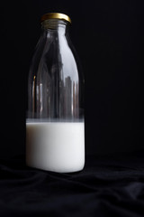 Bottle of kefir for breakfast black background