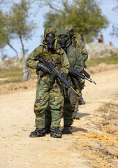 Fototapeta premium Soldiers on the battlefield with nuclear radiation anti-radiation equipment