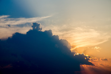 Sunset / sunrise with clouds, light rays and other atmospheric effect