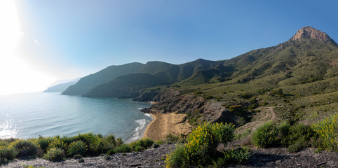 Green mountains and sandy beaches of regional park of Calblanque, Monte de las Cenizas and Pe&ntilde;a del Aguila in Spain