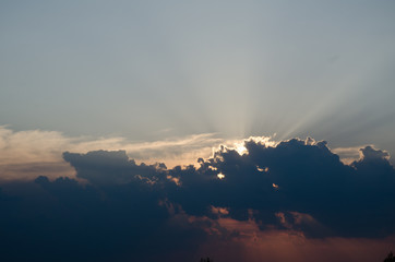 Sunset / sunrise with clouds, light rays and other atmospheric effect