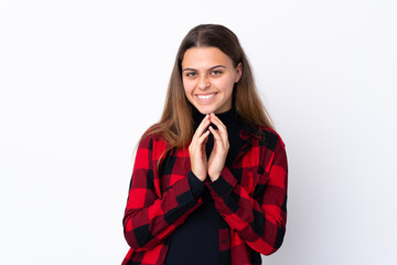 Teenager girl over isolated white background scheming something
