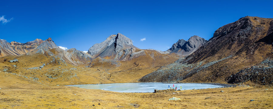 Panoramic view of the Kicho Tal (Ice lake, 4600 m) in winter sunny day. Annapurna circuit trek, Nepal.