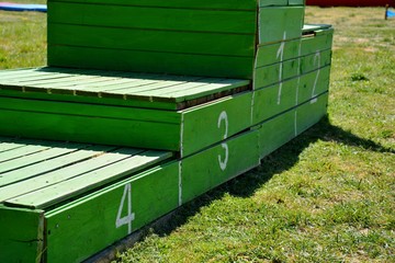green podium with four boxes