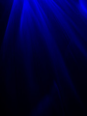 Abstract fine art photography of light filtering through deep marine blue