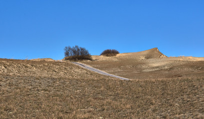 Sunset view of nordic dunes and Baltic sea at Curonian spit, Nida, Klaipeda, Lithuania