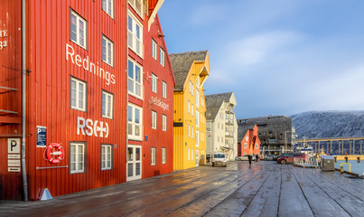 Obraz premium Wooden quay and colourful houses in Tromsø. Visit with Hurtigruten.
