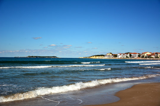 view of the beach with sea and blue sky