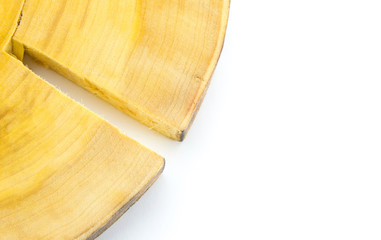 Part of the cut of the tree trunk is light yellow with a large crack. Wooden disc On a white background, not completely, but only the edge.