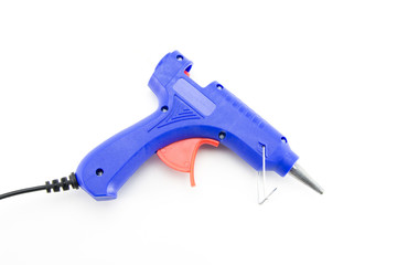 New blue glue gun for hot melt adhesive on a white isolated background. High quality tool for...