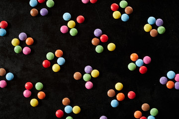 Colorful groups of five sugar-coated candies