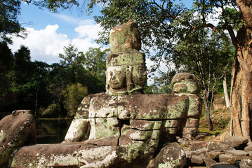 stone statues of the ancient temple complex of angkor watt in cambodia