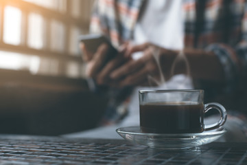 Man using smartphone at coffee shop