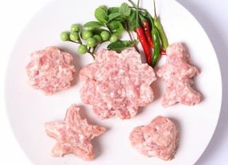 Raw ground meat on white plate for cooking