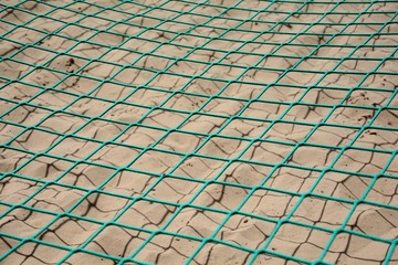 a green net over the sand