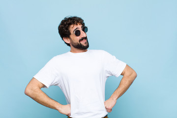 young crazy bearded man wearing sunglasses