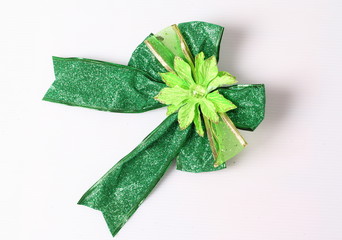 Green bow made of ribbon isolated on white