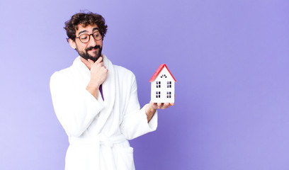 young crazy bearded man  wearing bathrobe home concept