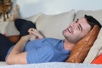 Relaxed man enjoying the sofa 