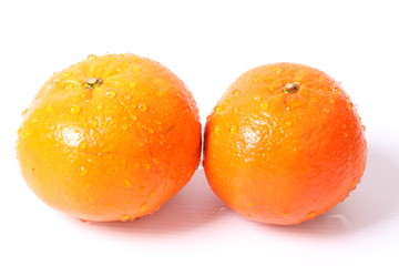 Orange with water drops on a white background