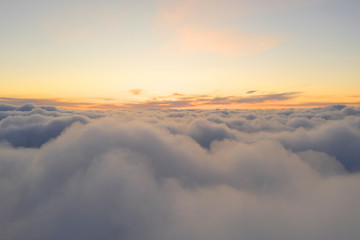 Aerial view White clouds in blue sky. Top fly. Looking from the drone. Aerial bird's eye view....