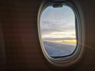 Beautiful sunset view from window plane