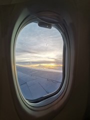 Beautiful sunset view from window plane