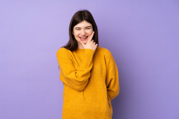 Obraz premium Young Ukrainian teenager girl over isolated purple background smiling