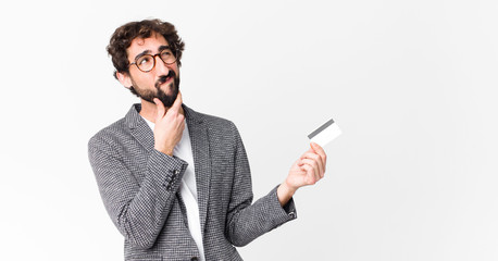 young crazy bearded man with a credit card