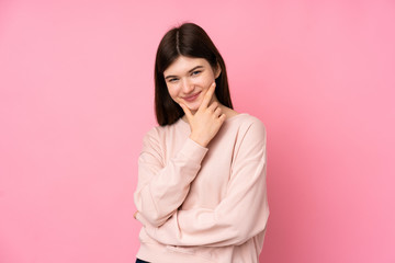 Obraz premium Young Ukrainian teenager girl over isolated pink background looking to the side