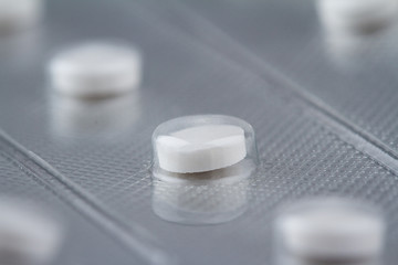 macro closeup of medical round pill packaging blister