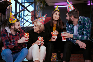Modern office center multi ethnic workers and attractive cheers with cup of coffee in front of the camera while have a break time