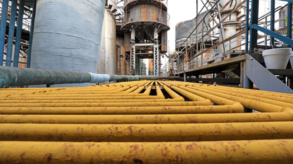 Yellow metal pipes in the factory