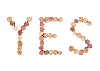 The word YES is made from wine corks. Isolated on white background