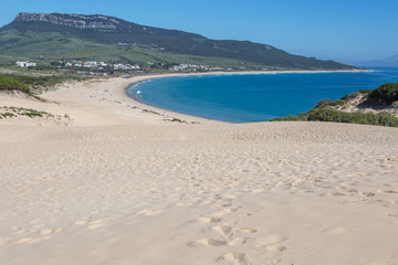 Sunny beach with sand dune, playa de Bolonia, Andalusia, Spain Atlantic coast