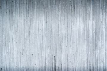 Fototapeta na wymiar vertical striped concrete facade background texture with copy space