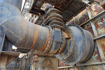 Unused and abandoned metal pipes in factories