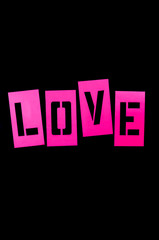 LOVE message spelled out in bright pink stencil letters on black background