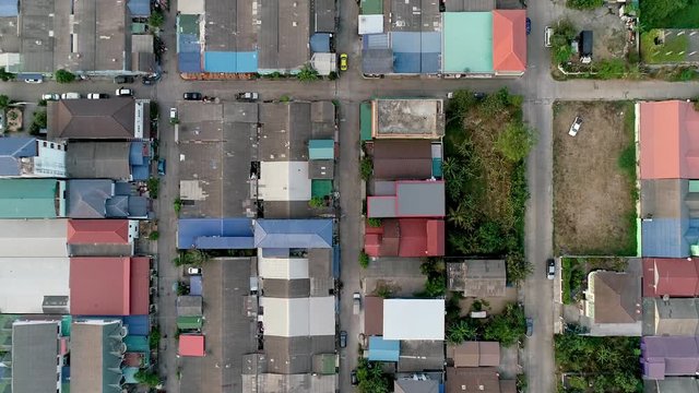 Aerial top down forward of roofs of community Pathum Thani. Thailand
