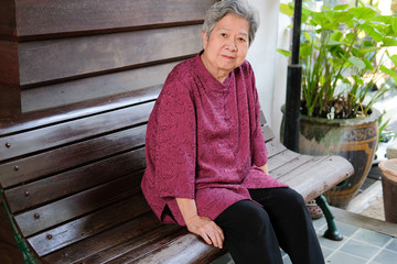 old elder woman resting in garden. elderly female relaxing in park. senior leisure lifestyle