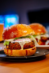 Homemade vegan burger. Plant-based burger with red beans, chickpea and lentils.