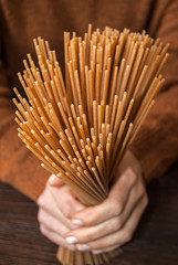  whole grain pasta and vegetables. Best food for diabetics.  buckwheat noodles in female hands