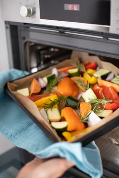 Close Up Of Roasting Tray Of Vegetables For Vegan Meal In Oven