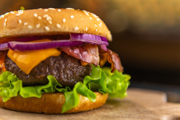 Extreme close up of a tasty, delicious, freshly made hamburger on a pub or restaurant table