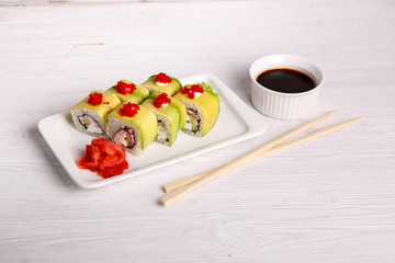 avacado rolls for the restaurant menu on a light wooden background