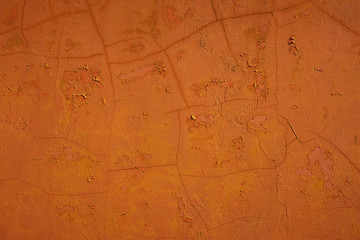 Fototapeta na wymiar shabby stucco with cracks and flakes of paint