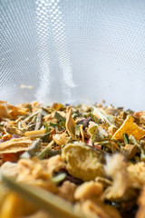 Inside a tea bag herbal tea on a light background