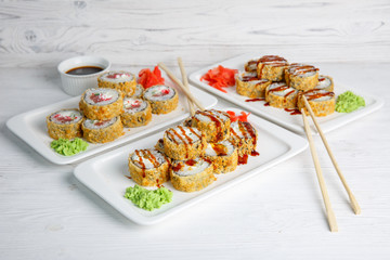 set of rolls for the restaurant menu on a warm wooden background