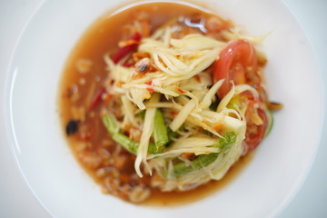 papaya salad in white dish