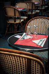 Street view of a coffee terrace with tables and chairs, Paris, France